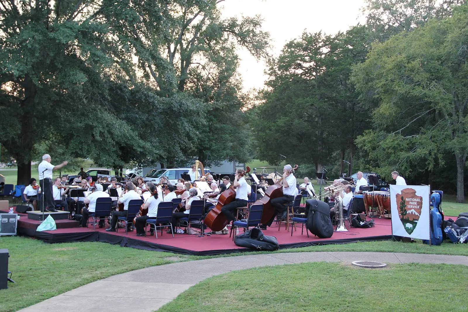 The Germantown Symphony Orchestra playing an outdoor concert on a lawn at Shiloh National Military Park, Tennessee.