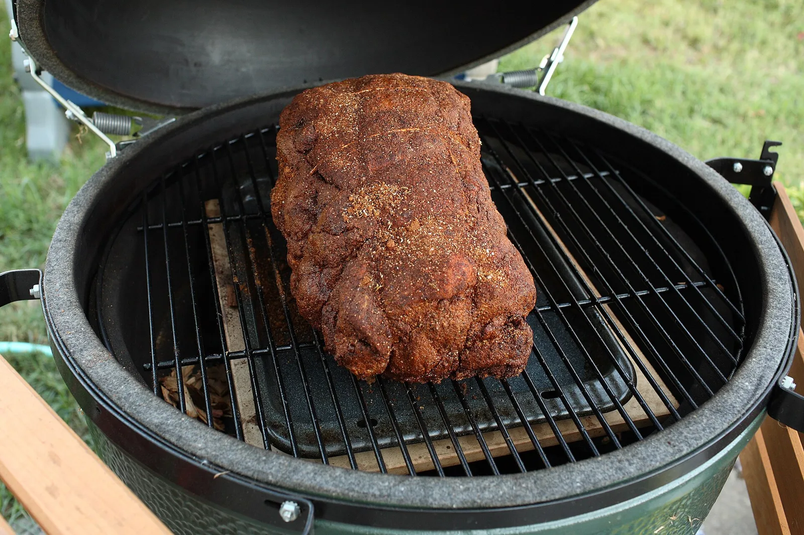 A seasoned pork shoulder on a backyard smoker. The picture does not show the association's barbecue.