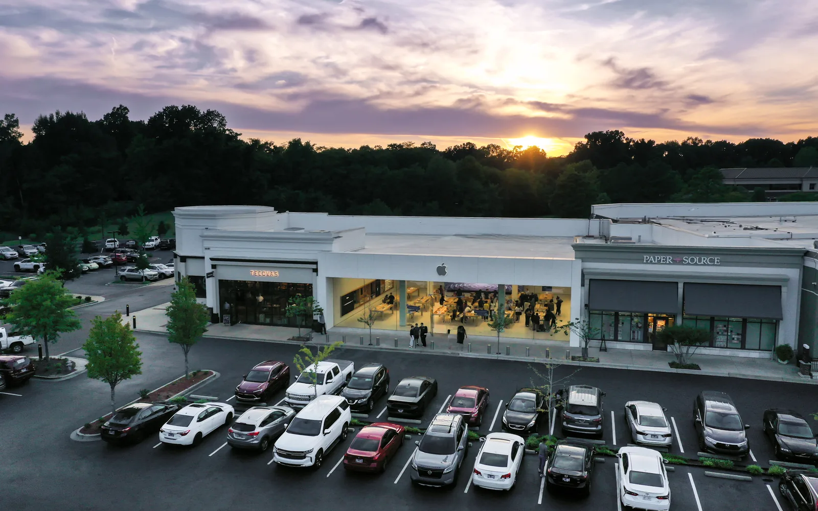 Tecovas, Apple and Paper Source stores facing the parking lot at the Saddle Creek shopping center in Germantown's Central Business District