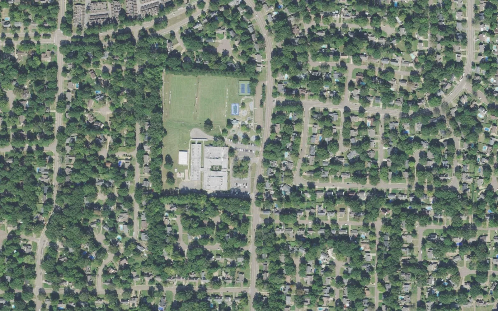 Farmington Elementary School and Farmington Park on Cordes Road in Germantown, seen from the air among the neighborhood's wooded streets
