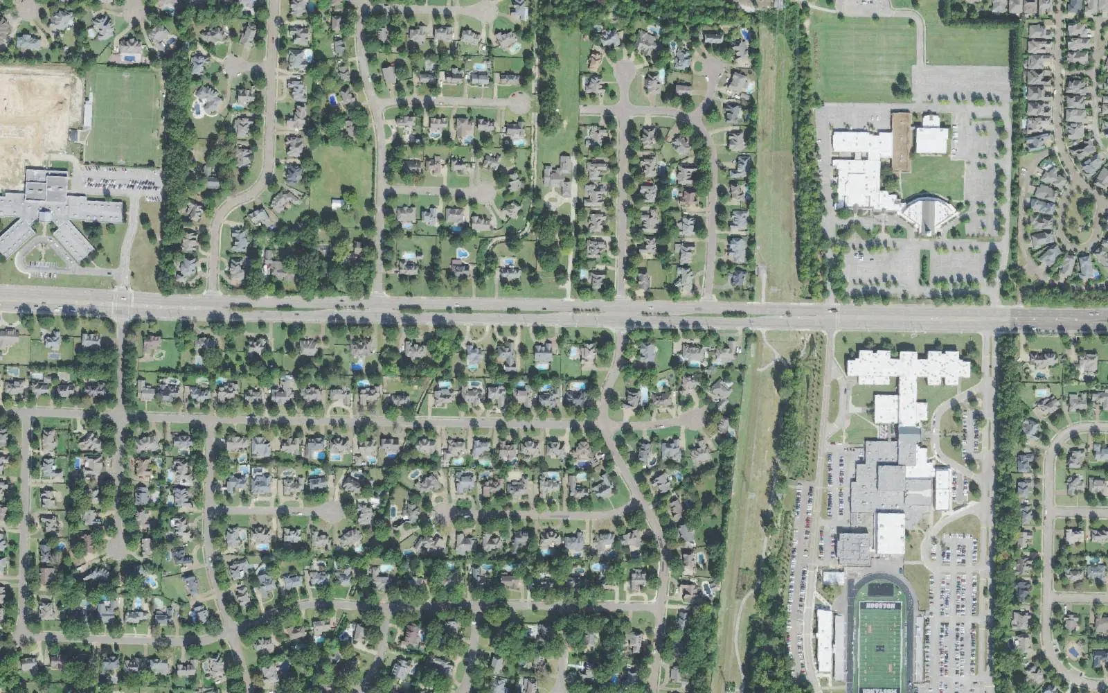 Houston Middle School, left, and Houston High School with its stadium, right, on Wolf River Boulevard in east Germantown, seen from the air