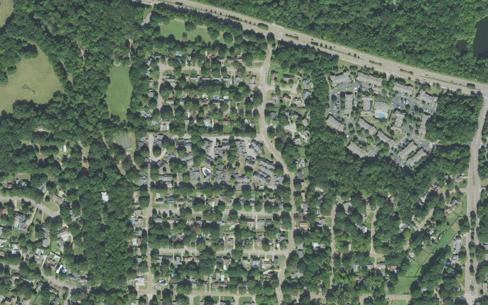 Poplar Estates in northwest Germantown from the air: houses on wooded streets, with Wolf River Boulevard across the top of the picture