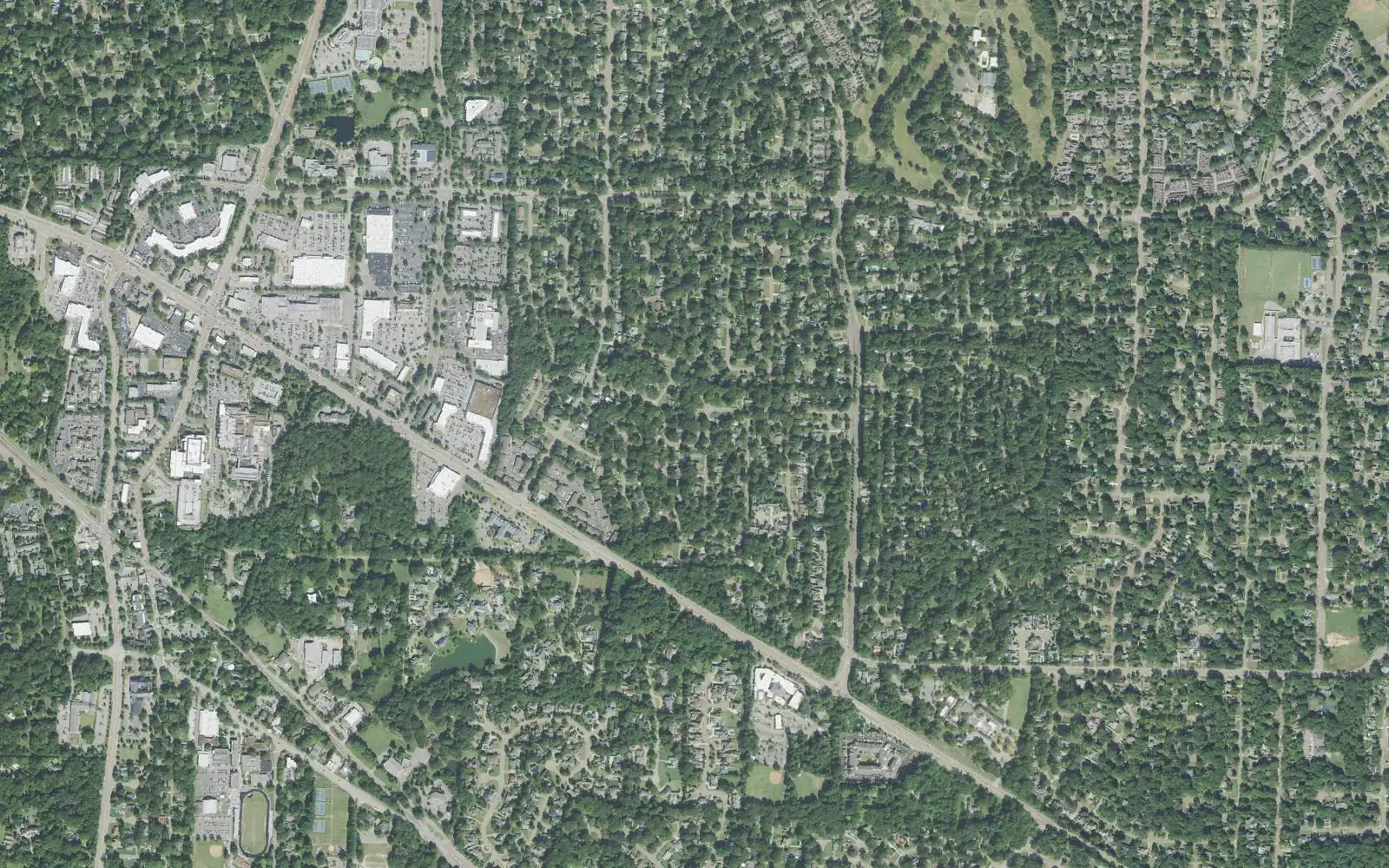 Central Germantown from the air: Poplar Avenue running diagonally past the shopping centers of the Central Business District, at upper left, and wooded residential streets