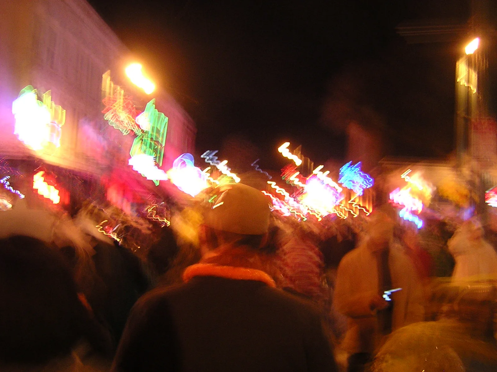 Crowds and neon signs blur together on Beale Street in downtown Memphis on New Year's Eve.