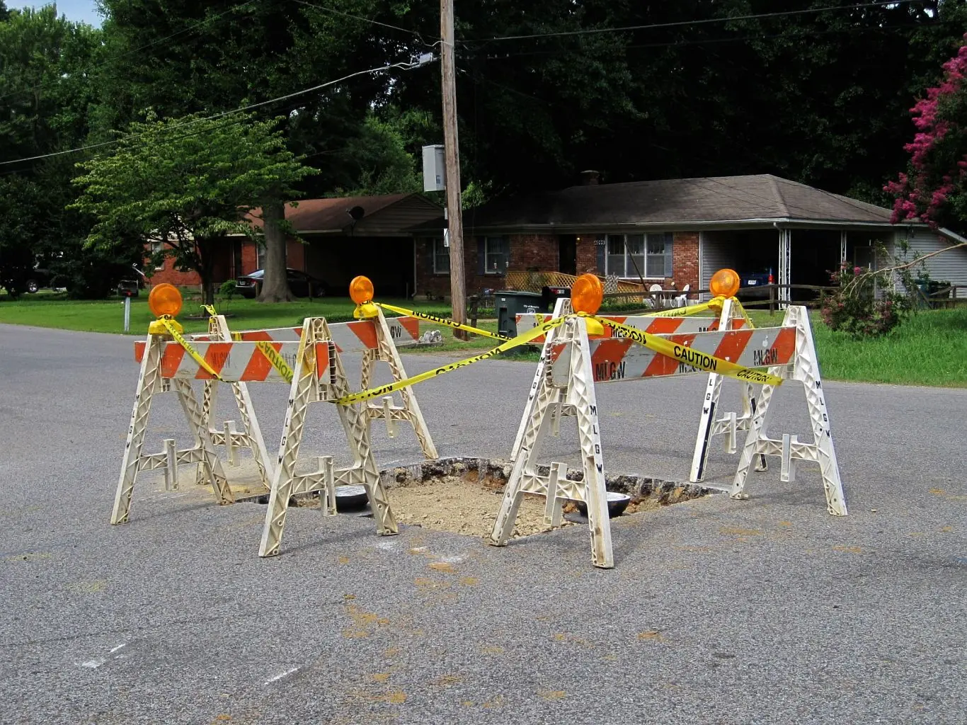 An MLGW crew repairing equipment from a bucket truck in the Frayser area of Memphis.