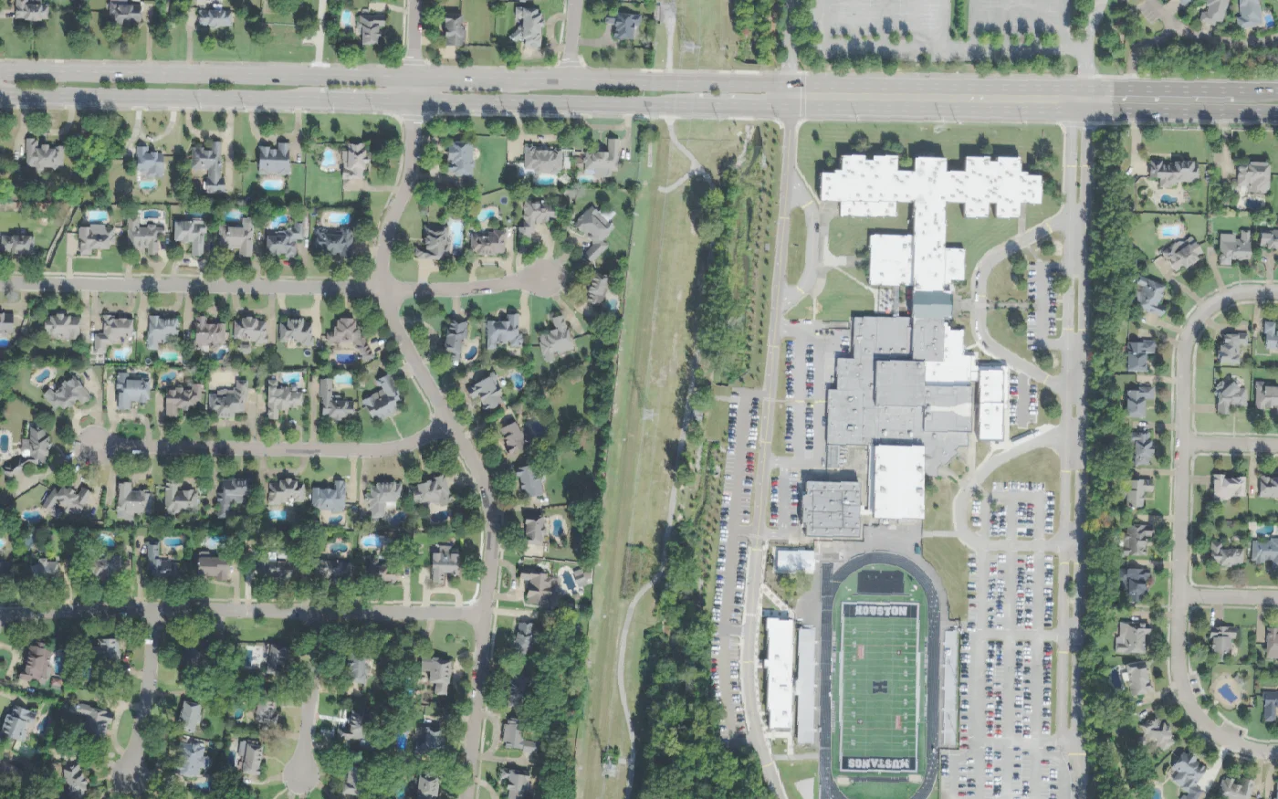 Houston High School and its football stadium beside Wolf River Boulevard in Germantown, seen from the air.