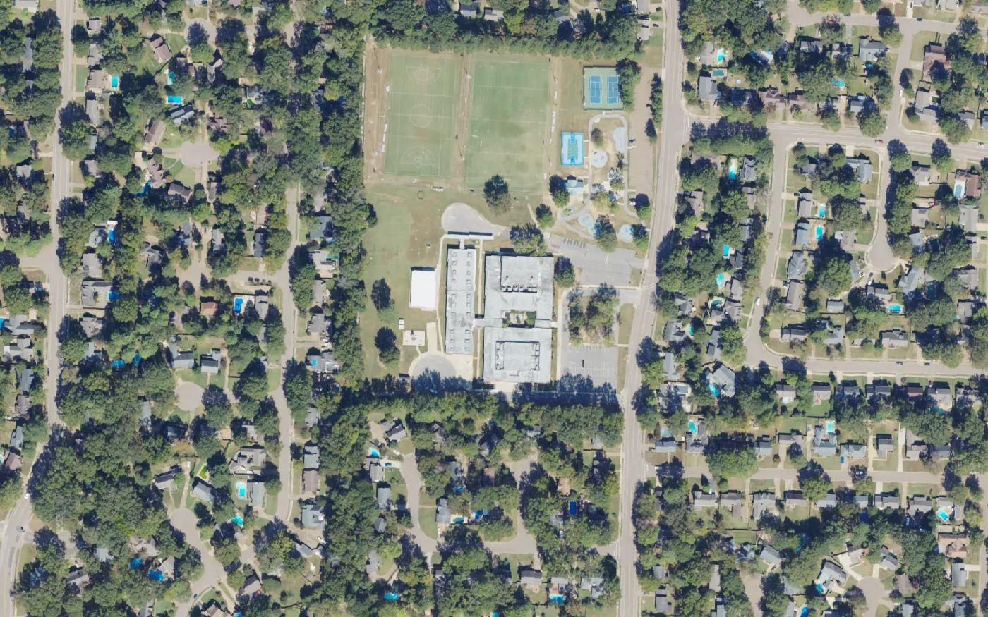 Farmington Elementary School and its playing fields, playground and tennis courts on Cordes Road in Germantown, seen from the air.