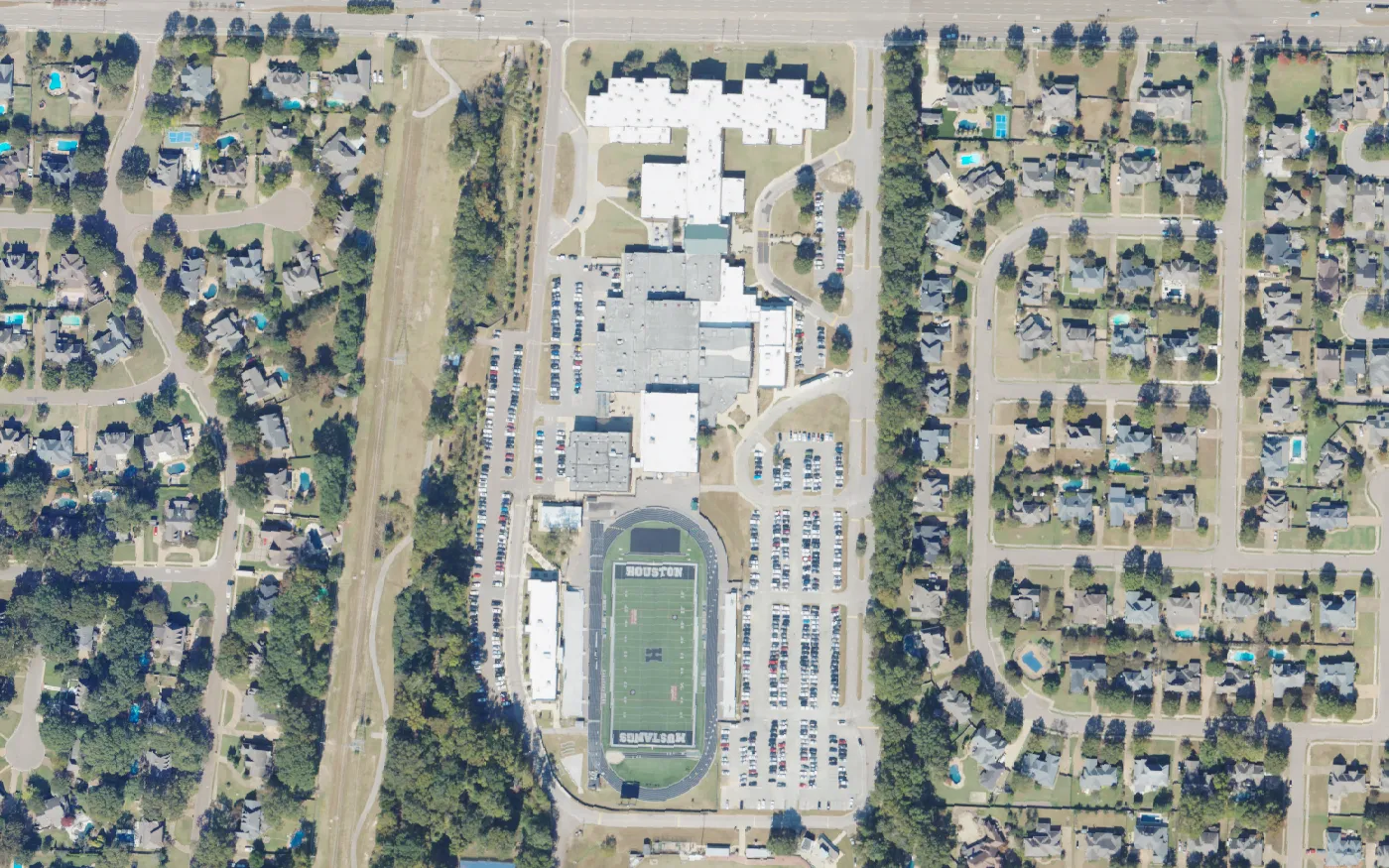 Houston High School, its parking lots and its football stadium off Wolf River Boulevard in Germantown, seen from the air.