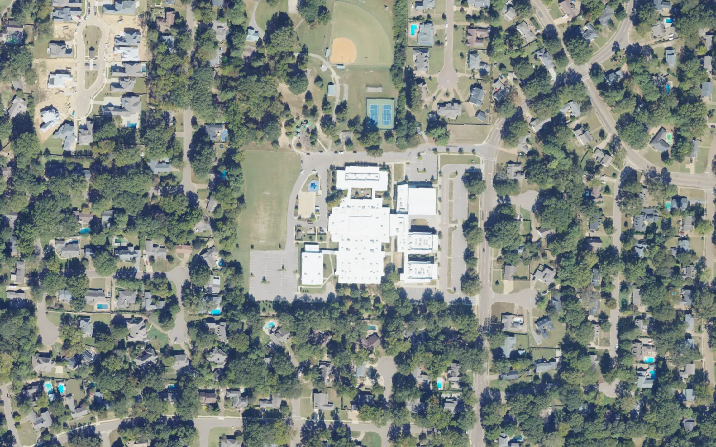 Riverdale K-8 School, with its playing fields and tennis courts to the north, in west Germantown, seen from the air.
