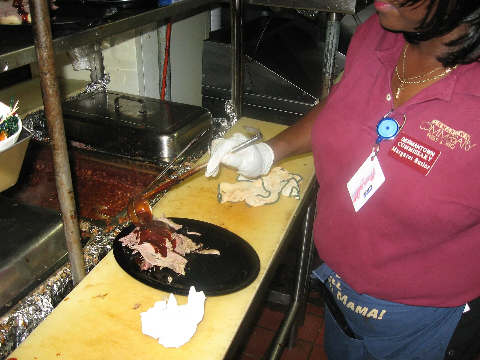 A cook plates pulled pork in the kitchen of the Germantown Commissary on South Germantown Road in 2008.
